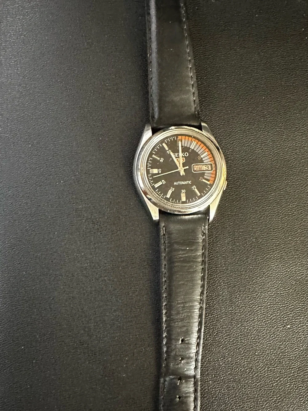 Seiko Black Dial Watch with Orange and Gray Accents
